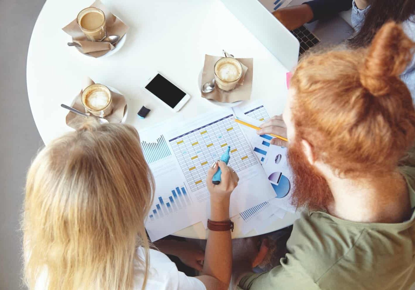 team-young-colleagues-having-meeting-cafe_273609-15660